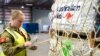 FILE - Humanitarian aid supplies are loaded on a airplane heading to Vanuatu, March 4, 2023, as part of the Australian Government's response to the Tropical Cyclones Judy and Kevin, at Amberley Base in Queensland. 