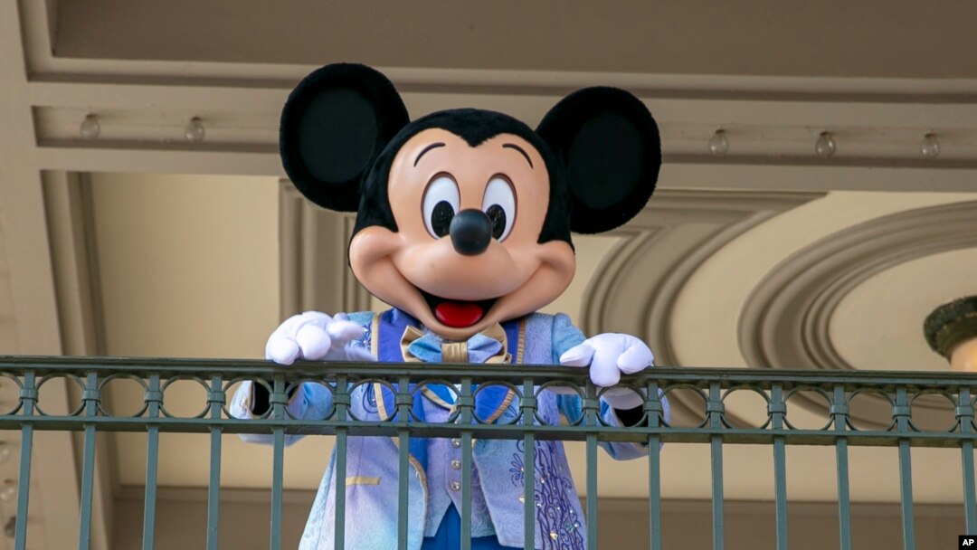 FILE - An actor dresses as Mickey Mouse at Walt Disney World Resort, April 18, 2022, in Florida. The earliest version of Disney's most famous character will become public domain on Jan. 1, 2024. (AP Photo/Ted Shaffrey, File)