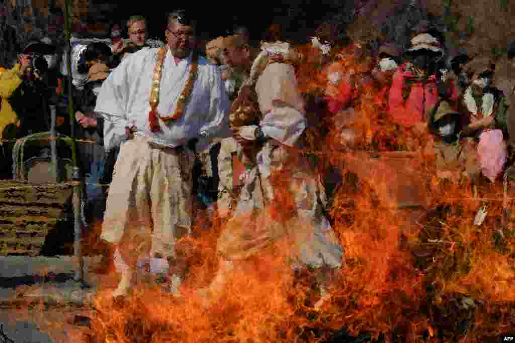 Buddhist monks take part the Nagatoro Hi-Matsuri, or fire walking festival, to pray for good health and safety in Nagatoro town, Saitama prefecture, Japan.