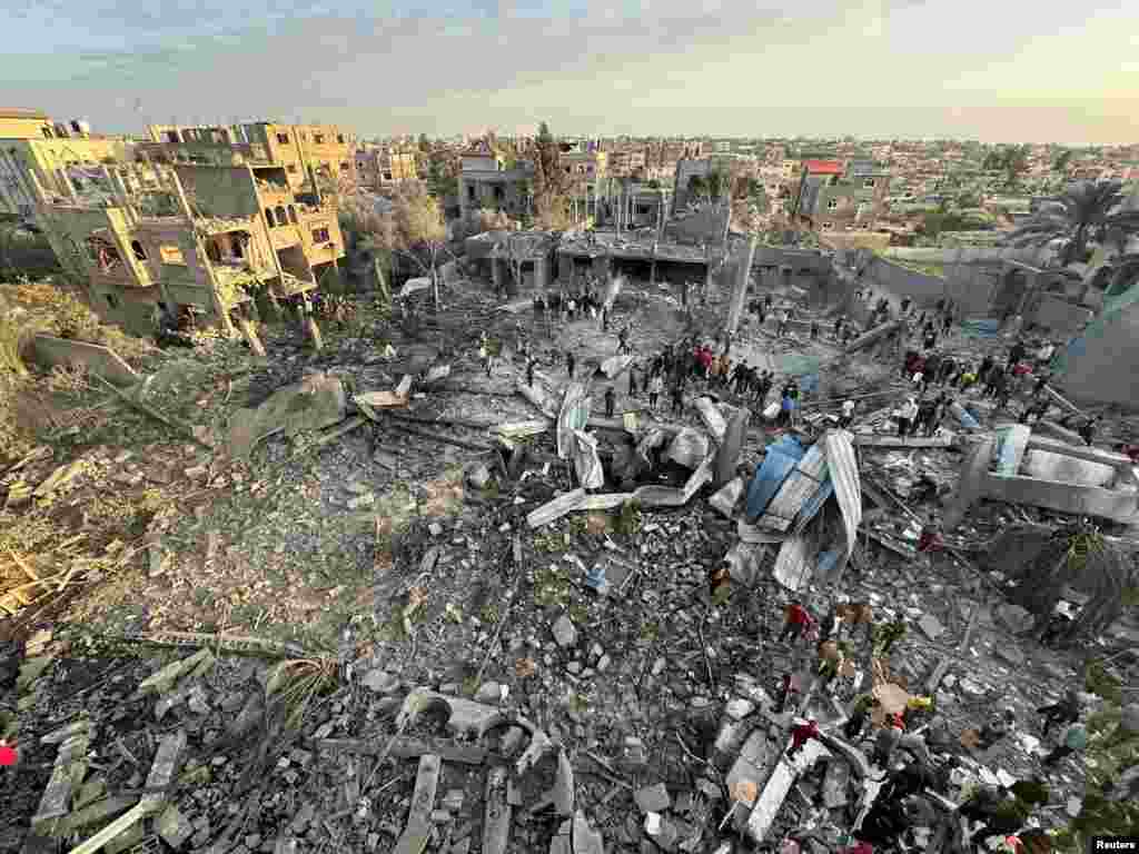 Palestinians inspect the site of an Israeli strike on a mosque in Rafah in the southern Gaza Strip.