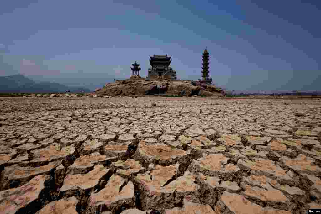 Pagodas are seen on Louxingdun island that usually remain partially submerged under the water of Poyang Lake, which is facing low water levels due to a regional drought in Lushan, Jiangxi province, China.