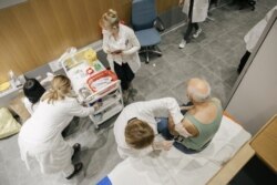 A man receives a Pfizer-BioNTech Covid-19 vaccine at a clinic in Belgrade, Serbia on January 13, 2021.