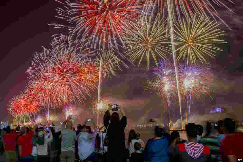 Fireworks illuminate the sky over UAE's capital city, Abu Dhabi, during celebrations ahead of the 46th Emirati National Day, celebrated on Dec. 2.