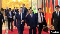 2022年11月13日，德国总理朔尔茨与越南总理一起在河内参加联合记者会。（路透社照片）