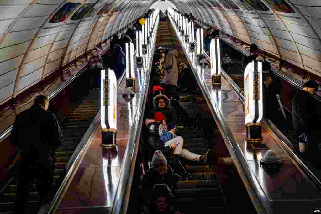 Civilians take shelter inside a metro station during air raid alert in the center of Kyiv, amid the Russian invasion of Ukraine.