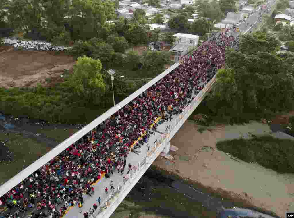 Central American migrants - mostly Hondurans, travelling on caravan to the U.S - remain at the international bridge that connects Tecum Uman, Guatemala, with Ciudad Hidalgo, Mexico.