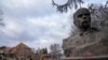 A bust of Taras Shevchenko, Ukrainian poet and national symbol, stands against the background of a house of culture ruined after a night air raid in the village of Byshiv, west of Kyiv, Ukraine, March 4, 2022. 