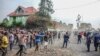 FILE - Demonstrators clash with police during a protest against the United Nations peacekeeping force MONUSCO deployed in the Democratic Republic of the Congo, in Sake, some 24 kilometers west of Goma, July 27, 2022.