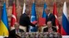 Turkish President Recep Tayyip Erdogan, right, and U.N. Secretary General Antonio Guterres lead a signing ceremony at Dolmabahce Palace in Istanbul, Turkey, Friday, July 22, 2022.