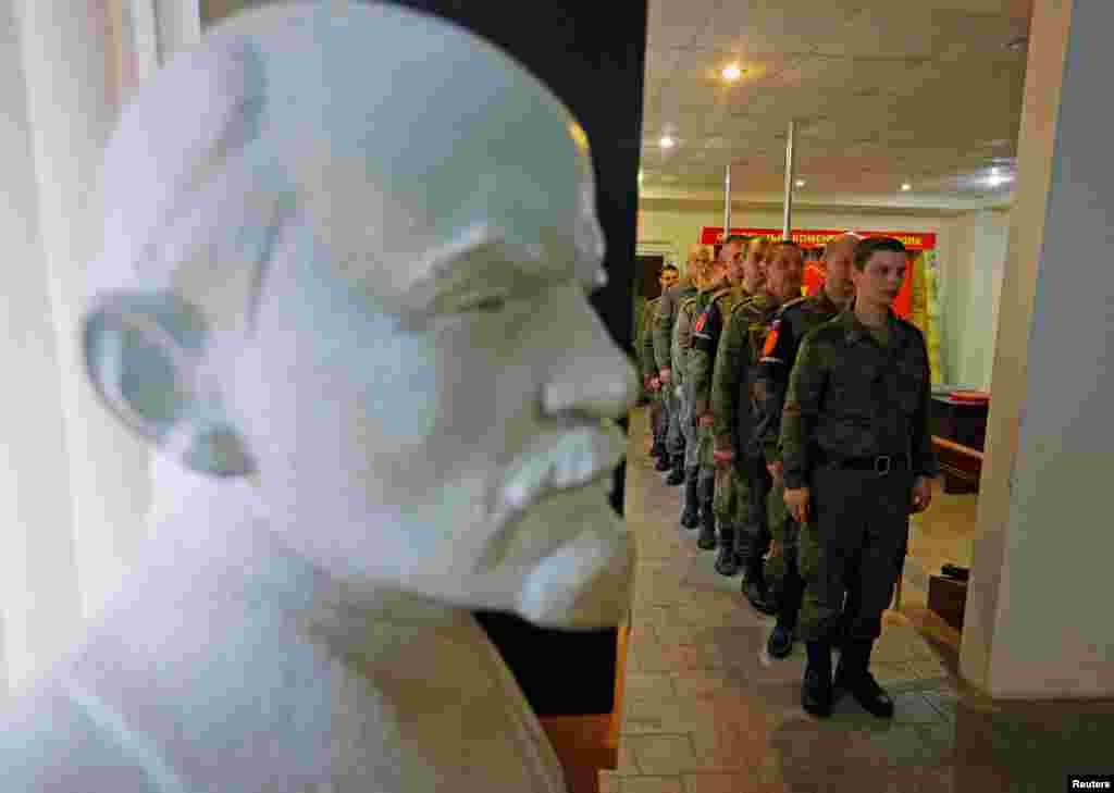Service members of the self-proclaimed Luhansk People's Republic (LPR) line up to vote during a referendum on joining LPR to Russia, at a military unit in Luhansk, Ukraine.