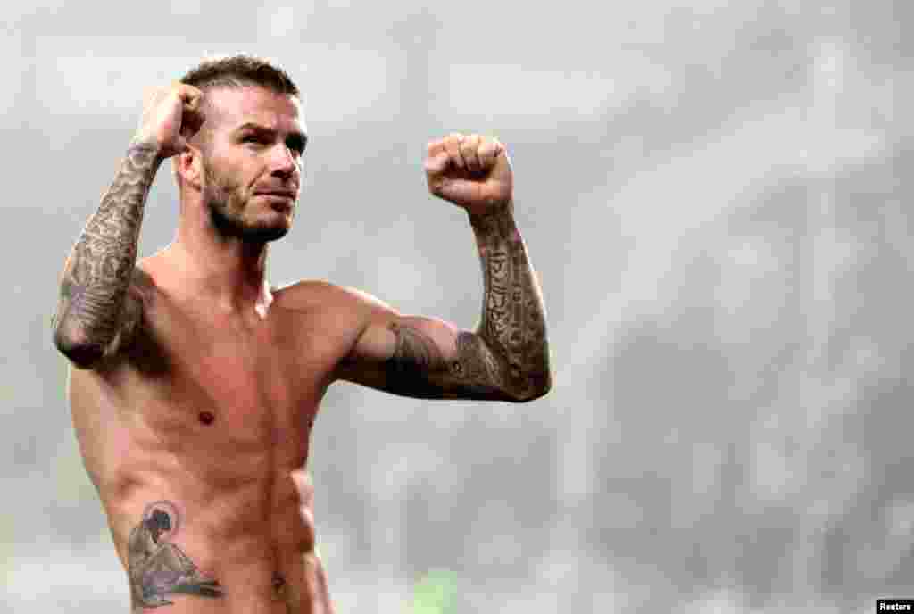 AC Milan's David Beckham celebrates at the end of the match of against Juventus during their match at Olympic stadium in Turin, January 10, 2010.