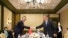 韩国外交部长朴振在印度尼西亚巴厘岛会晤中国外长王毅.