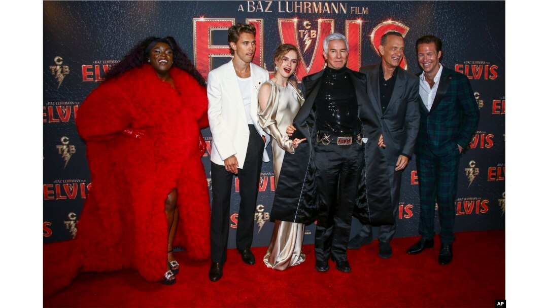 FILE - From left, Yola, Austin Butler, Olivia Dejonge, director Baz Luhrmann, Tom Hanks and Luke Bracey pose for photographers upon arrival for the premiere of the film 'Elvis' in London, Britain, May 31, 2022.