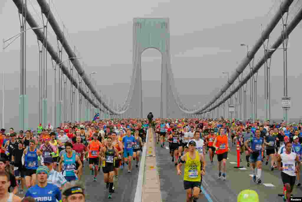 The first wave of runners make their way across the Verrazano-Narrows Bridge during the start of the New York City Marathon.