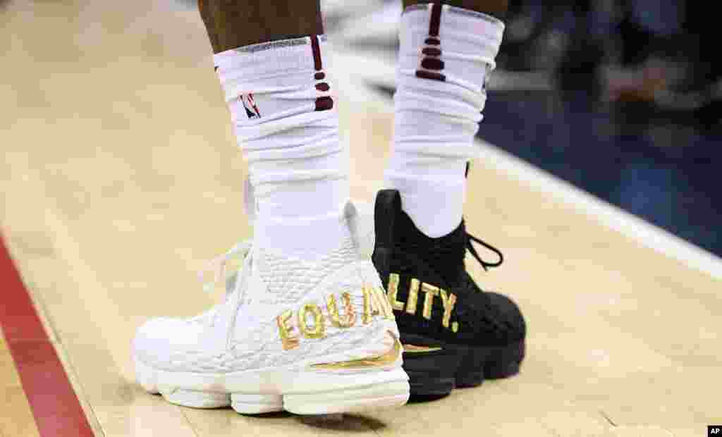 Cleveland Cavaliers forward LeBron James’ wears one white shoe and one black emblazoned with the word ‘equality’.