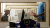 FILE - A patient, right, is attended to at an AIDS clinic at the Helen Joseph Hospital in Johannesburg.