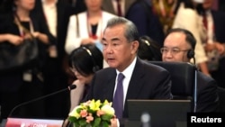 中共中央外事工作委员会办公室主任王毅2023年7月13日）在印尼雅加达出席东盟外长扩大会议。（路透社）