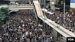 香港民主派组织民间人权阵线发起大游行，要求港府正式撤回《逃犯条例》，以及设立独立委员会调查警民冲突。(2019年7月21日)