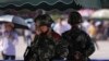 中国防暴警察守在北京地铁站以防范维吾尔族激进分子。