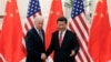 资料照：2013年12月4日中国国家主席习近平与来访的美国副总统拜登握手 