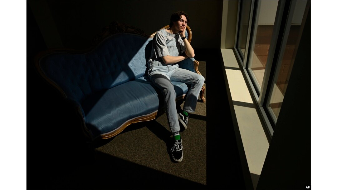 Grayson Hart sits for a portrait at the Ned R. McWherter West Tennessee Cultural Arts Center in Jackson, Tenn., on Saturday, March 4, 2023, where he directs a youth theater program. (AP Photo/Mark Zaleski)