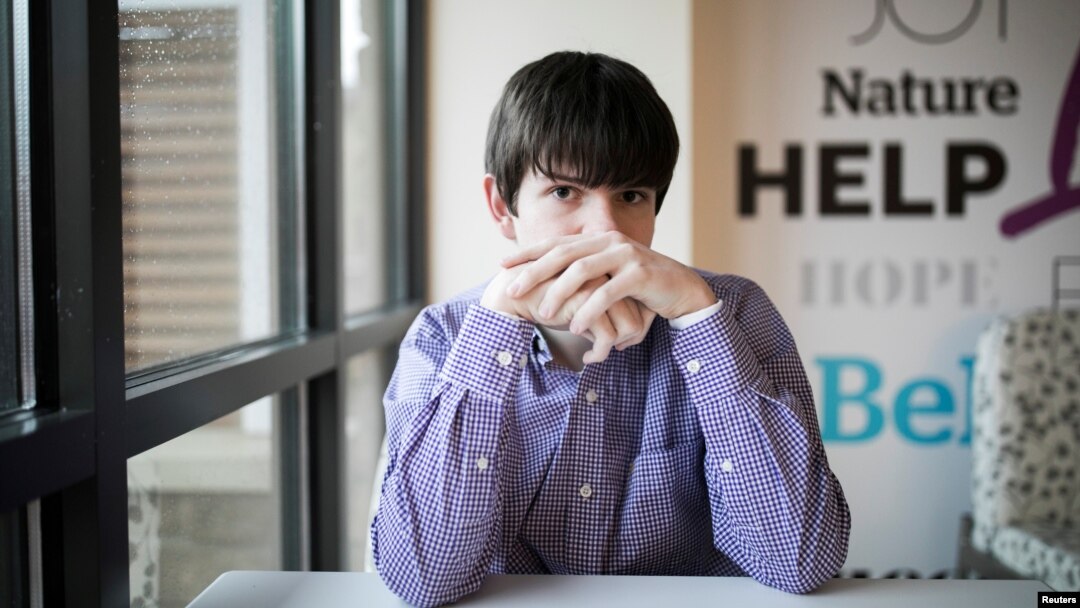 Danny Reagan, a former residential patient of the Lindner Center of Hope, sits in a common room at the center, in Mason, Ohio, Jan. 23, 2019.