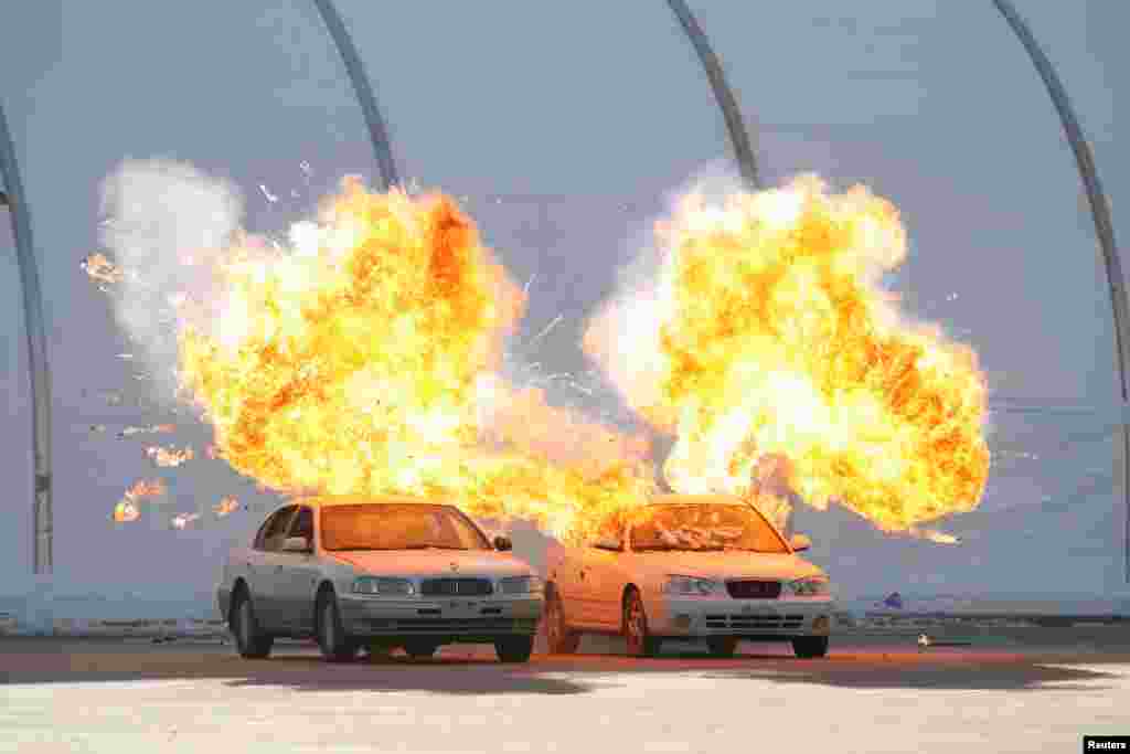 Vehicles explode during a security drill ahead of the 2018 Pyeongchang Winter Olympic Games at the Olympic Stadium, venue for the opening and closing ceremonies in Pyeongchang, South Korea.
