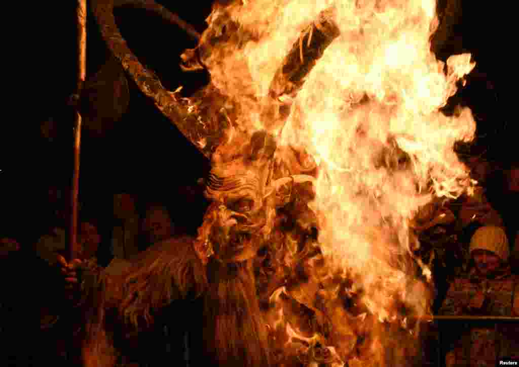 A man dressed as a devil performs during a Krampus show in Goricane, Slovenia.