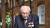 British World War II veteran Captain Tom Moore, 99, walks a lap of his garden in the village of Marston Moretaine, 50 miles north of London, April 16, 2020.