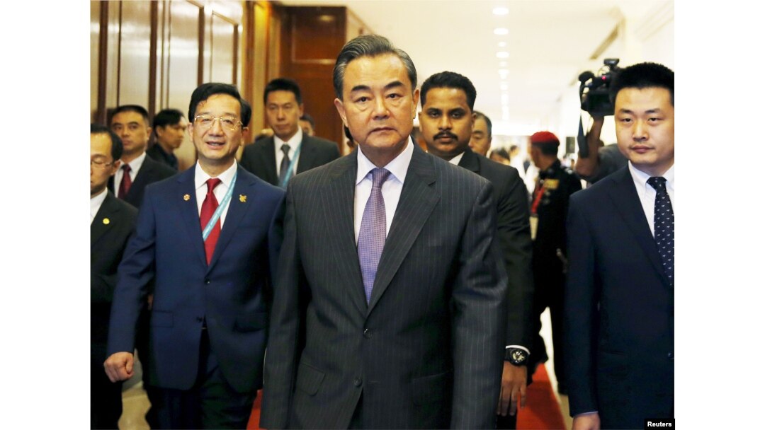 China's Foreign Minister Wang Yi arrives at a meeting during the 48th Association of Southeast Asian Nations (ASEAN) foreign ministers meeting in Kuala Lumpur, Malaysia, Aug. 4, 2015.