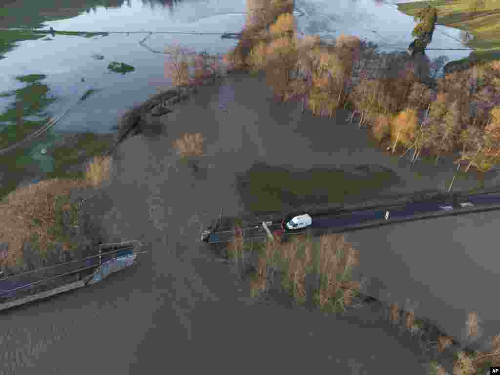 Llanerch Bridge over the flooded river Clwyd near Saint Asaph in north Wales is seen after large parts of central and northern England and Wales were caught in the path of Storm Christoph, Saint Asaph, Wales, UK.