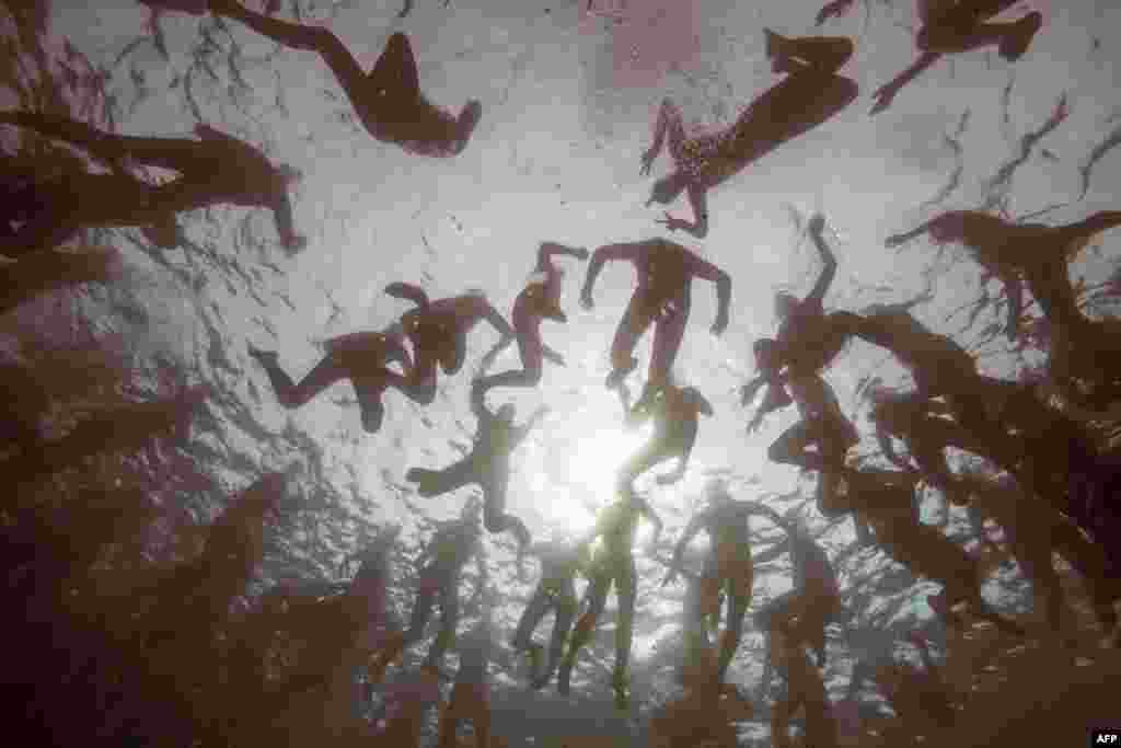 Swimmers wait for the start of the "Monte-Cristo challenge" ("Le Defi Monte-Cristo") swim event at the Chateau d'If off Marseille, southern France, June 23, 2017.
