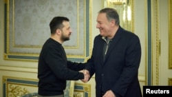 Ukraine's President Zelenskiy welcomes former U.S. Secretary of Sate Pompeo before a meeting in Kyiv