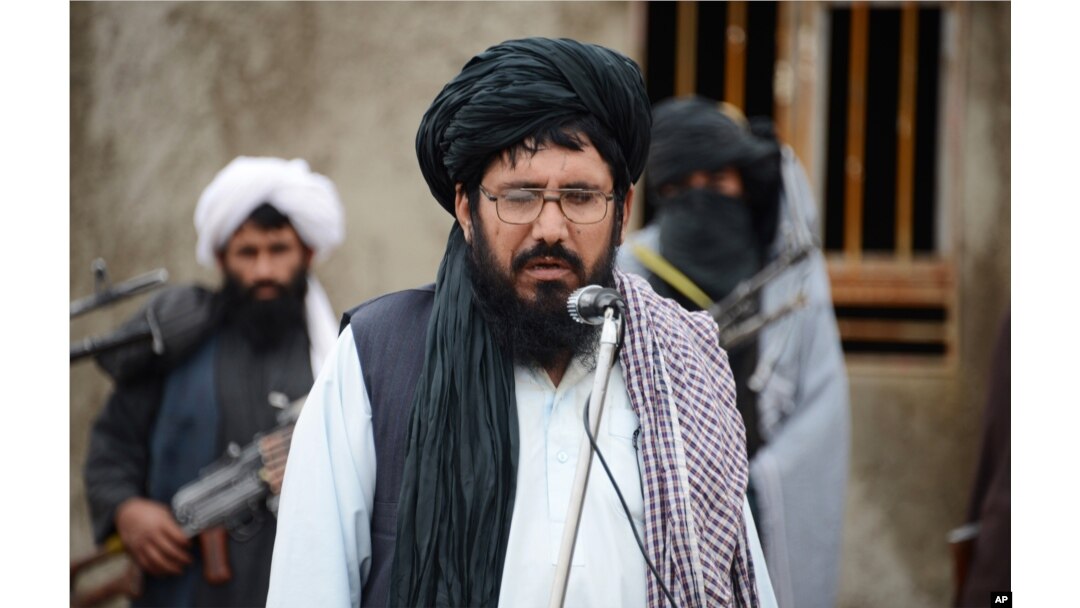 FILE - Mullah Mohammed Rasool, the newly-elected leader of a breakaway faction of the Taliban, speaks during a gathering in Farah province, Afghanistan.