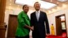 U.S. National Security Advisor Susan Rice, left, shakes hands with Chinese State Councilor Yang Jiechi at the Diaoyutai State Guesthouse in Beijing, China, Aug. 28, 2015.