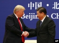 美国总统特朗普(左)与中国国家主席习近平2017年11月在北京会晤