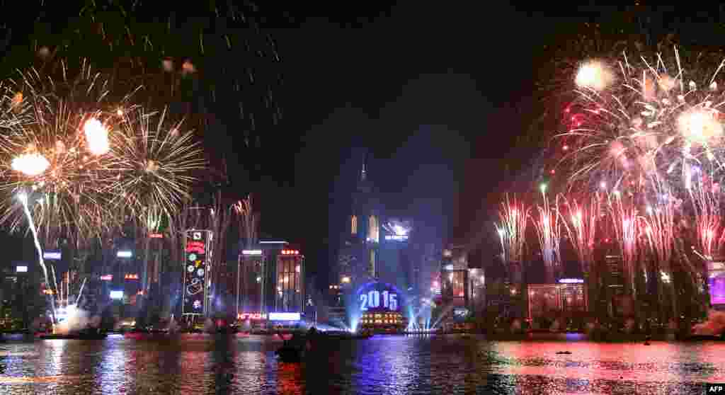 Fireworks explode over Victoria Harbour in Hong Kong. Just like previous years, the city's iconic skyline along Victoria Harbour will light up with an eight-minute pyrotechnic display, as tens of thousdands of partygoers will flock to the waterfront to celebrate the New Year.