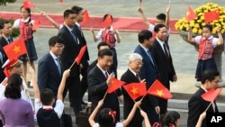 Chủ tịch Trung Quốc Tập Cận Bình và Tổng bí thư Nguyễn Phú Trọng trong chuyến thăm Việt Nam cuối năm ngoái.