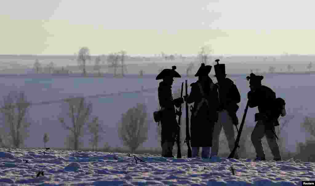Czech history enthusiasts dressed as soldiers stand guard ahead of a re-enactment of Napoleon's famous battle of Austerlitz, that will take place tomorrow, near the southern Moravian town of Slavkov u Brna, Czech Republic.