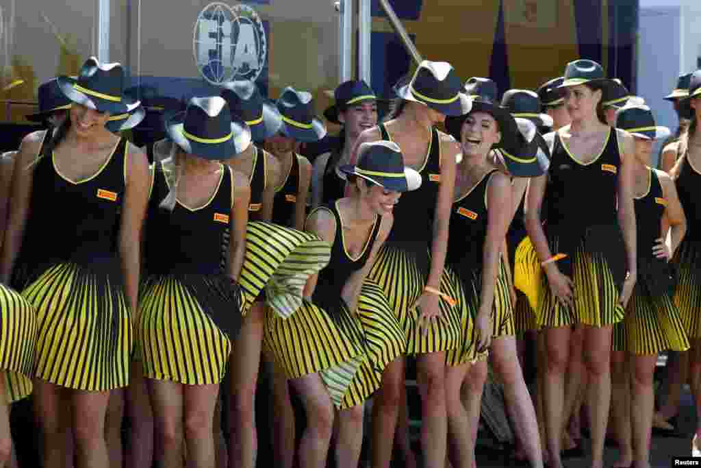 Grid girls are seen at the Hungaroring racing circuit in Budapest prior to the Formula One Hungarian Grand Prix, July 30, 2017.