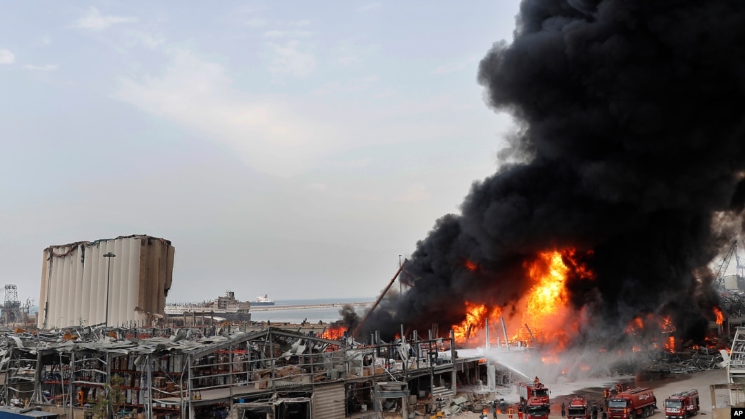 FILE - Firefighters work to extinguish a blaze at warehouses at the seaport in Beirut, Lebanon, Sept. 10, 2020.