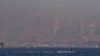 FILE - A thick blanket of smoke hangs over parts of Sydney, Sept. 14, 2023. On Sept. 19, 2023, Sydney experienced its first total fire ban in almost three years and several schools on the New South Wales state South Coast were closed because of a heightened wildfire danger 