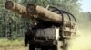 FILE - A truck carries logs in Preah Vihear province, 245 kilometers north of Phnom Penh, Cambodia. In January, Virgin Atlantic announced it was pulling out of Cambodia's first REDD+ project in Oddar Meanchey province following the release of an NGO's report that showed ongoing and rampant illegal logging linked to military syndicates.
