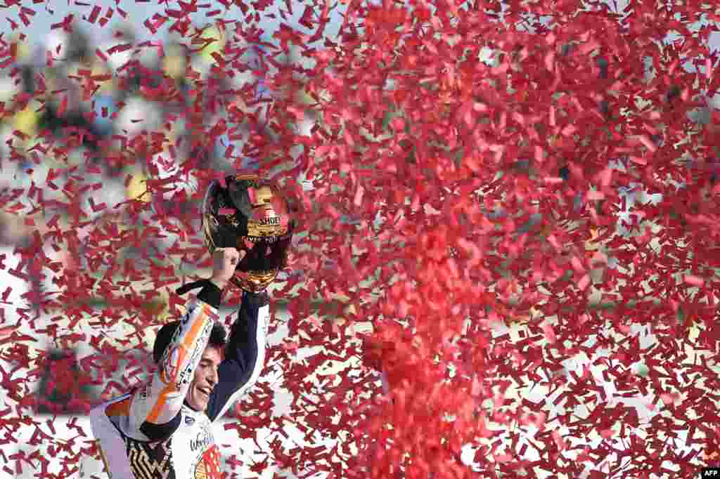 Repsol Honda Team's Spanish rider Marc Marquez celebrates after the MotoGP race of the Valencia Grand Prix at Ricardo Tormo racetrack in Cheste, near Valencia, Spain.