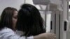 A woman undergoes a breast cancer screening