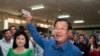FILE - Prime Minister Hun Sen of the Cambodian People's Party shows off his ballot paper before voting in local elections at Takhmau polling station in Kandal province, southeast of Phnom Penh, June 4, 2017. 