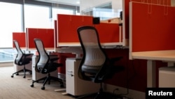 FILE PHOTO: People return to work in Philadelphia