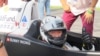 PS Racing车队的王日升戴着国际儿童慈善基金的标志参加珠海车赛（2013年9月15日）