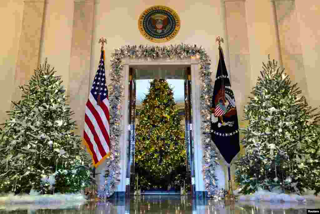The official White House Christmas tree is seen from the Cross Hall in Washington.