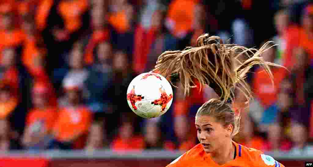 Netherlands' forward Lieke Martens heads the ball during the UEFA Women's Euro 2017 football match between Belgium and the Netherlands at Stadium Koning Wilhelm II in Tilburg, Netherlands, July 24, 2017.